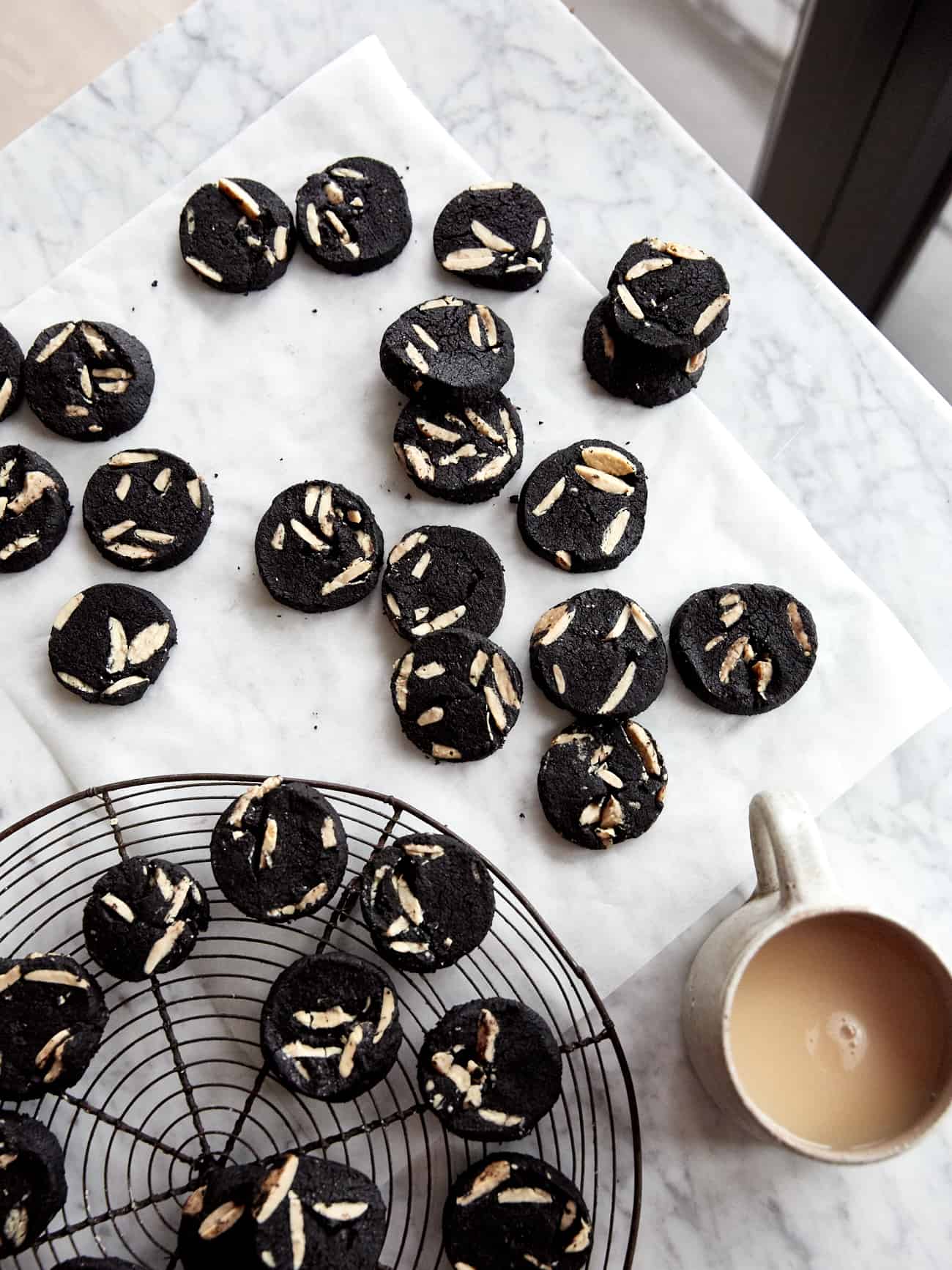 Cookies and cream shortbread on a marble table with a cup of tea