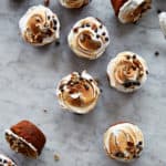 Sweet potato cupcakes with meringue frosting on a marble background