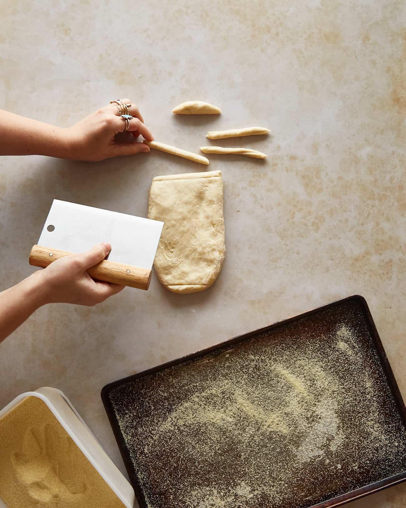 cutting pici dough into strips for cacio e pepe