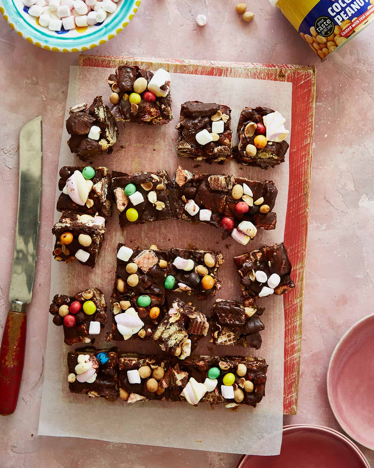 coconut peanut rocky road cut up on a board with marshmallows 