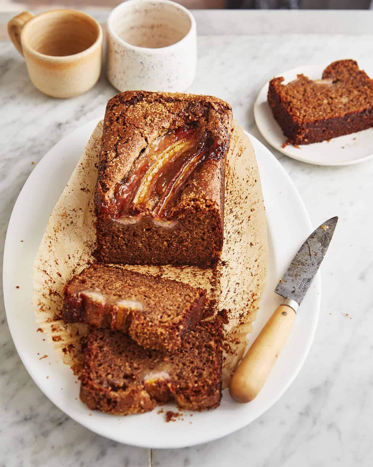 a few slices and a loaf of vegan sourdough banana bread