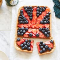 a treacle tart topped with berries in the shape of the union jack