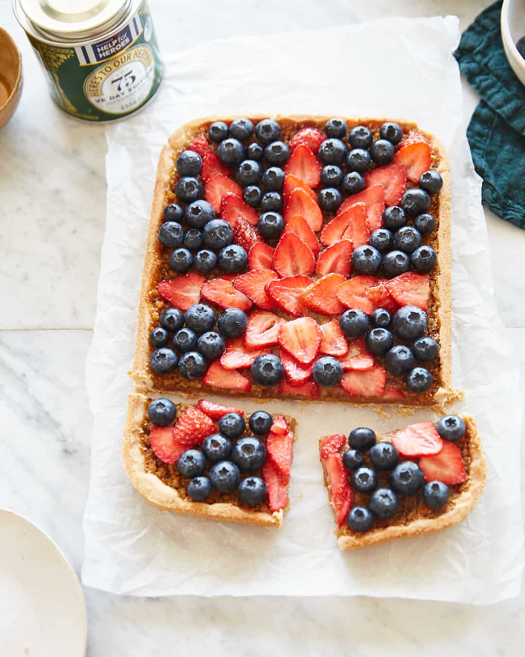a treacle tart topped with berries in the shape of the union jack