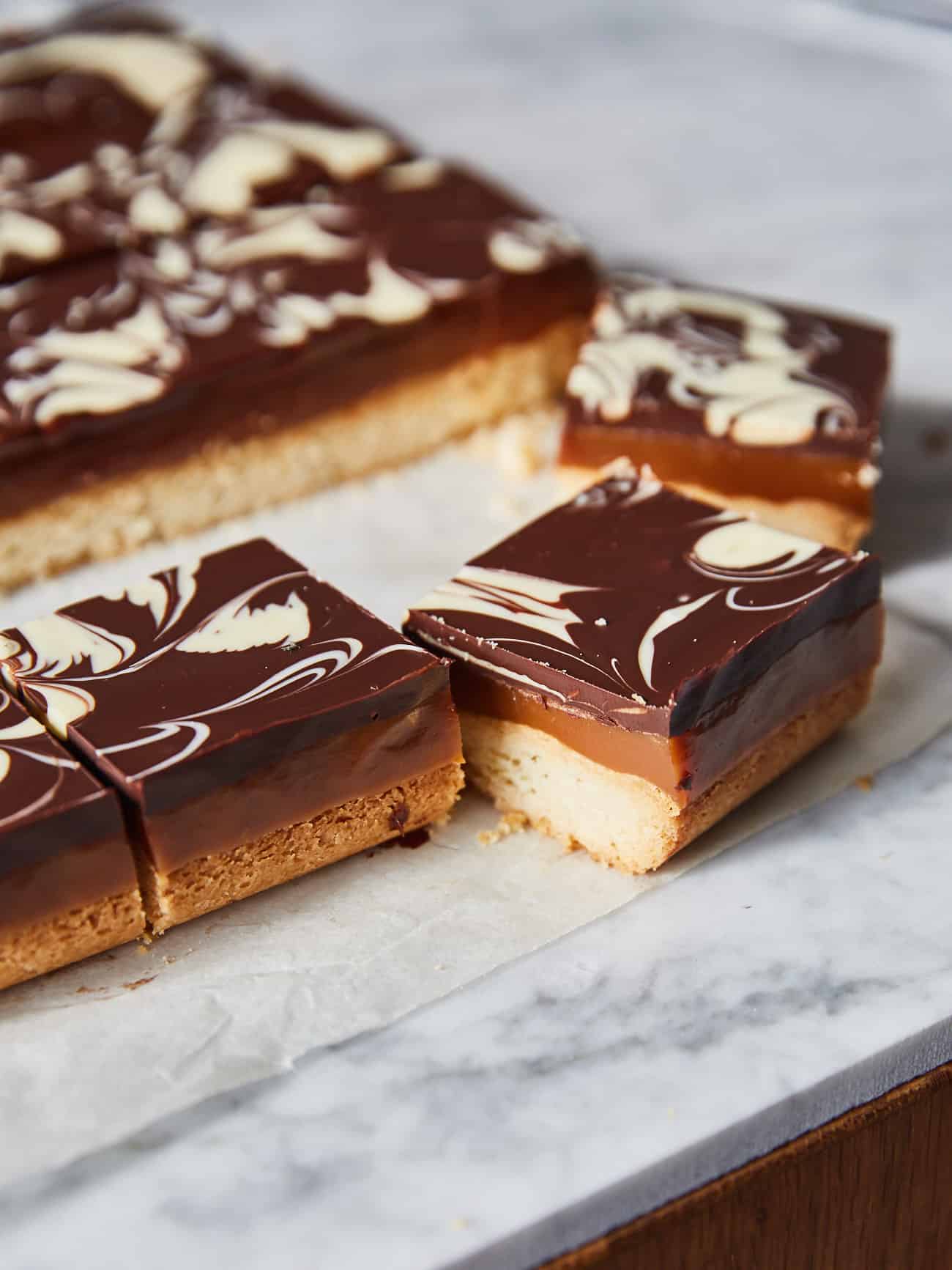 a side shot of a square of millionaire's shortbread