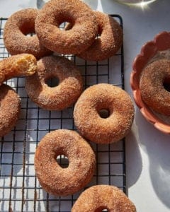 spiced easter doughnuts on a wire rack