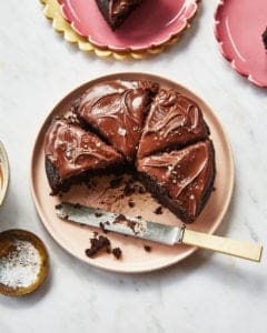 sliced easy chocolate cake on a pink plate