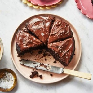 sliced easy chocolate cake on a pink plate