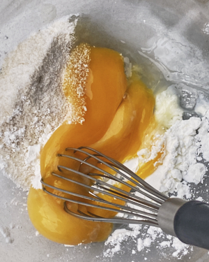 mixing egg yolks, cornflour and sugar for custard