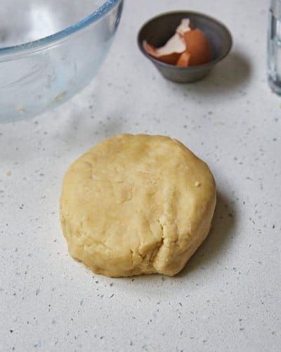 a disk of shortcrust pastry on countertop