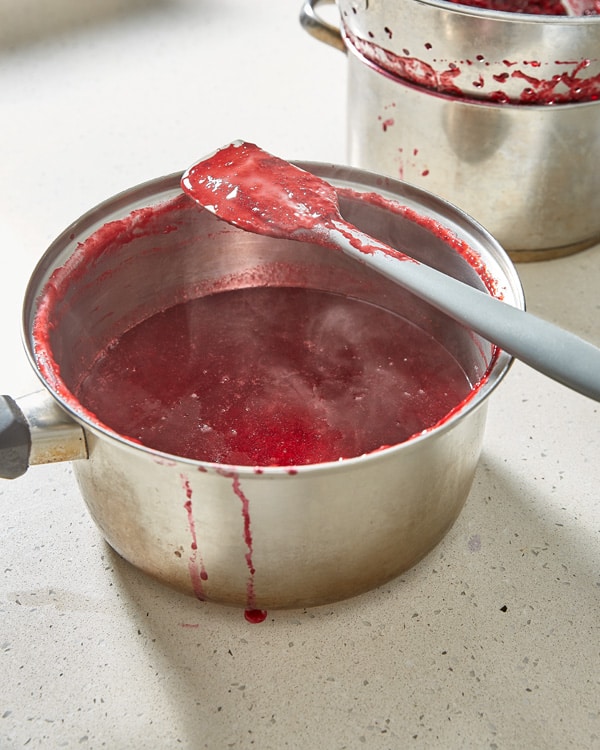 strained damson puree in a pot